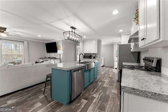 kitchen featuring under cabinet range hood, white cabinets, stainless steel appliances, and blue cabinets
