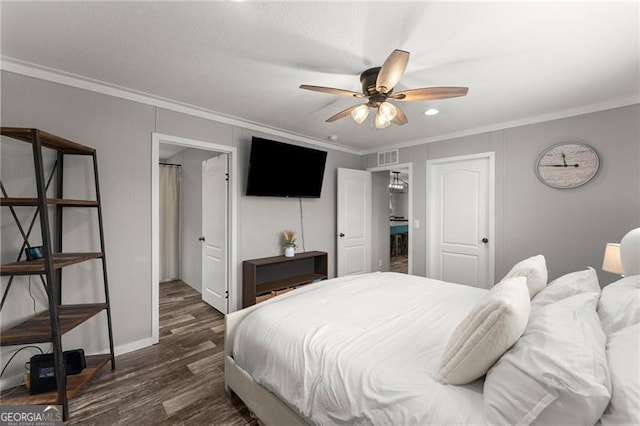 bedroom with dark wood-style flooring, a ceiling fan, baseboards, and ornamental molding
