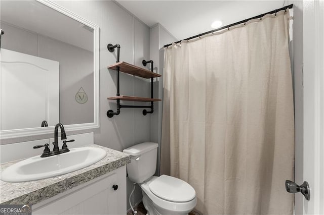 full bath with a shower with curtain, toilet, and vanity