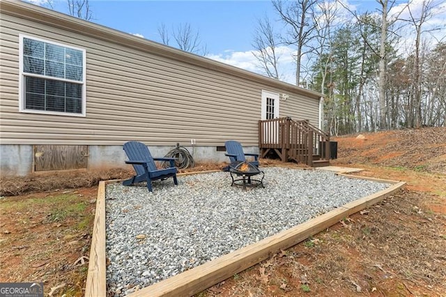 view of patio / terrace featuring a fire pit