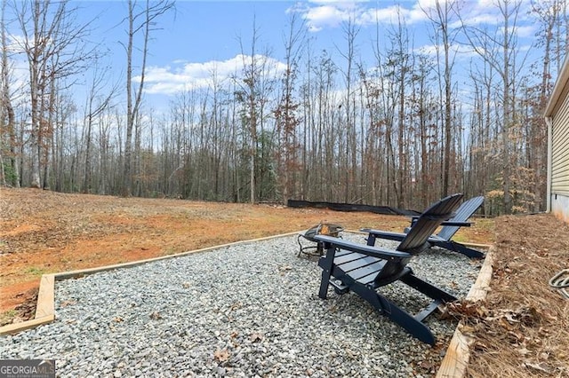 view of community with an outdoor fire pit