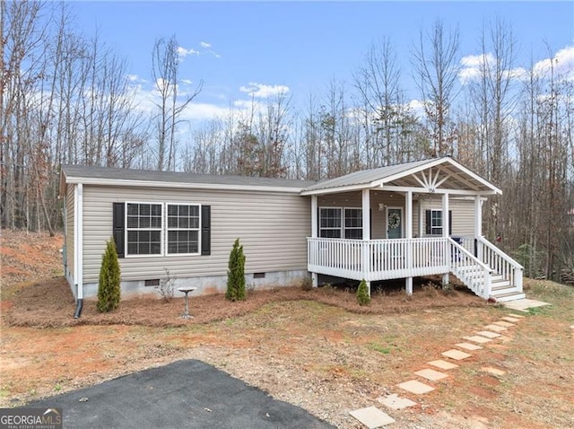 manufactured / mobile home featuring crawl space and covered porch