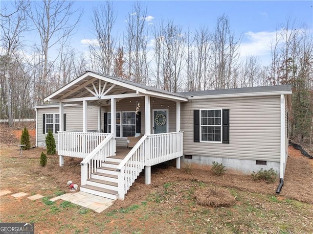 view of front of property featuring covered porch and crawl space