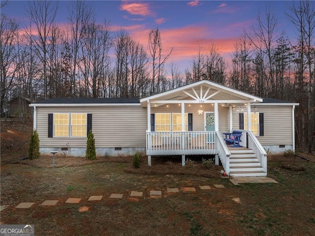 manufactured / mobile home with crawl space and a porch