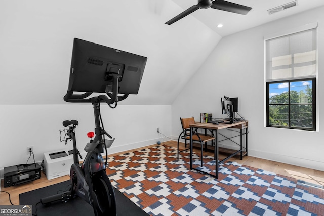 workout room featuring visible vents, baseboards, a ceiling fan, and vaulted ceiling