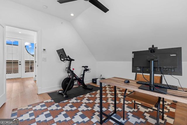 workout room featuring lofted ceiling, wood finished floors, recessed lighting, baseboards, and ceiling fan