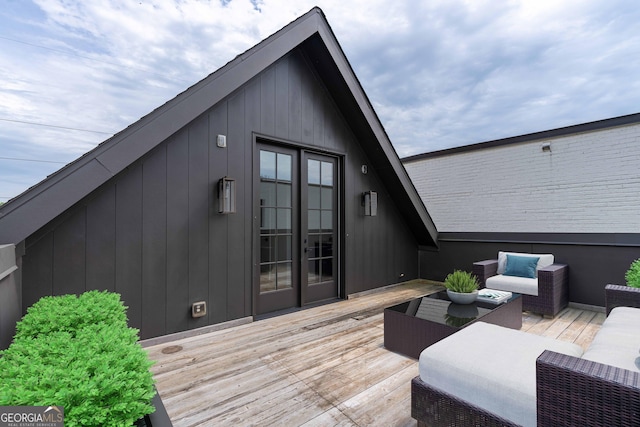 wooden deck featuring an outdoor living space