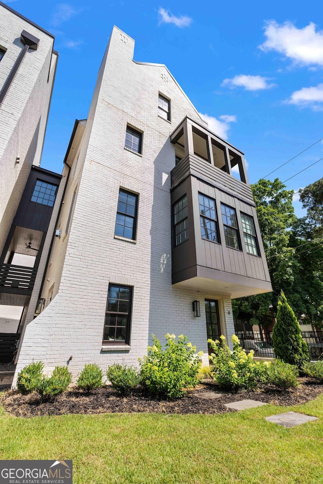 exterior space with brick siding