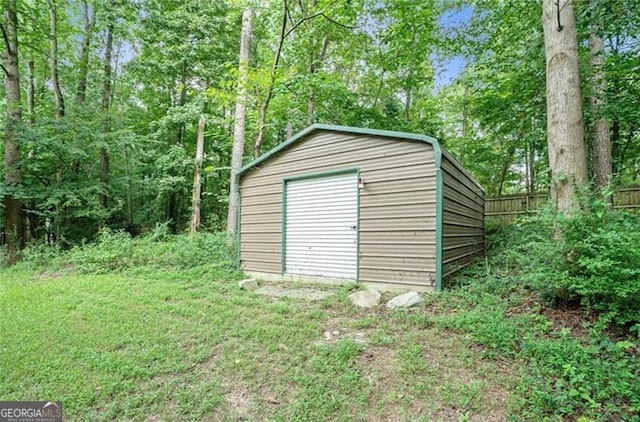 view of shed with fence