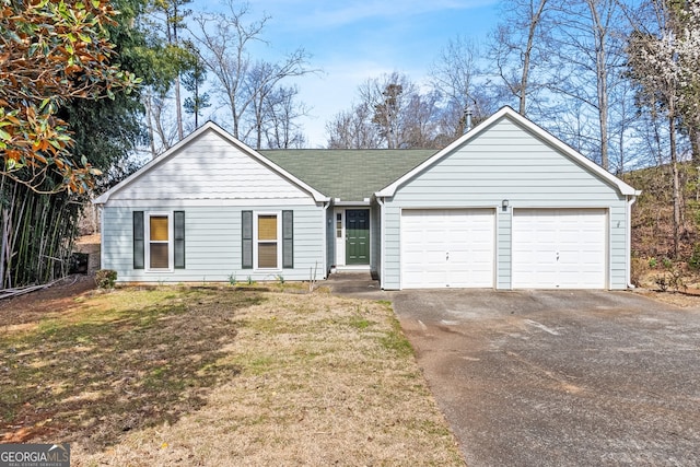 single story home featuring driveway, a front lawn, a garage, and roof with shingles