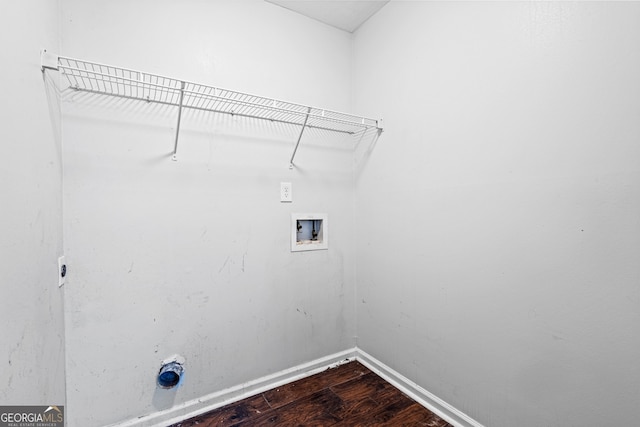 laundry room with laundry area, hookup for a washing machine, baseboards, and dark wood-type flooring