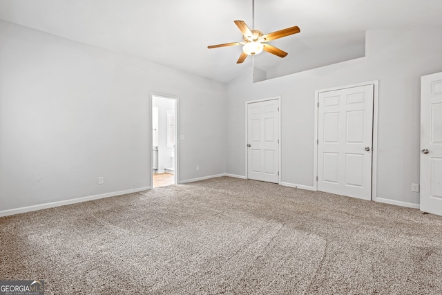 unfurnished bedroom with baseboards, carpet floors, lofted ceiling, and ceiling fan