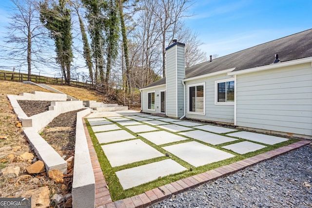 view of yard featuring a patio and fence