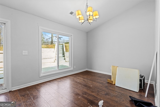 interior space with a chandelier, dark wood-style floors, visible vents, and baseboards