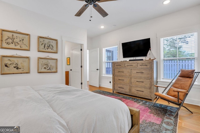 bedroom featuring recessed lighting, light wood-style flooring, baseboards, and ceiling fan