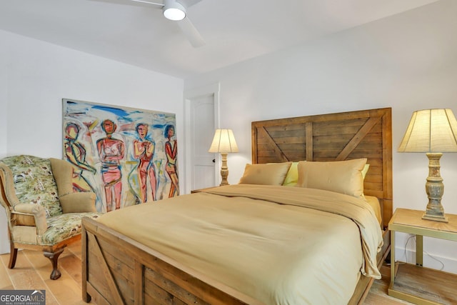 bedroom featuring light wood-style flooring and a ceiling fan