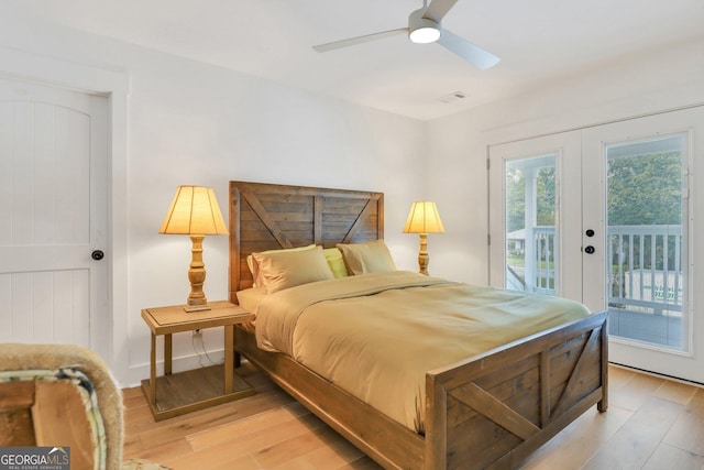 bedroom featuring light wood-style flooring, visible vents, access to exterior, and french doors