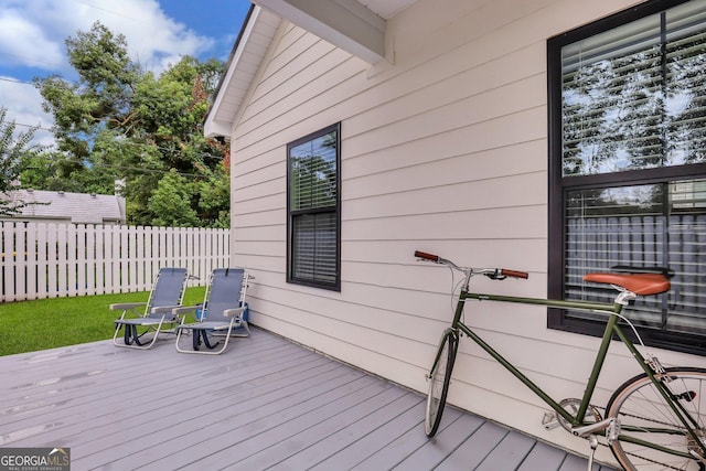 wooden deck featuring fence