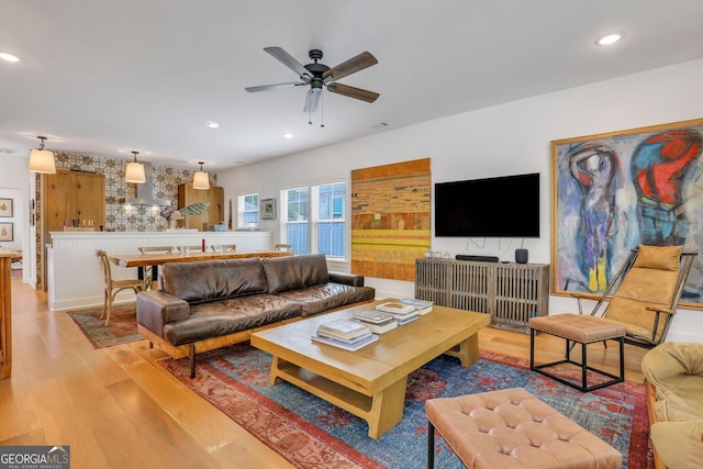 living room featuring recessed lighting, light wood-style floors, and a ceiling fan