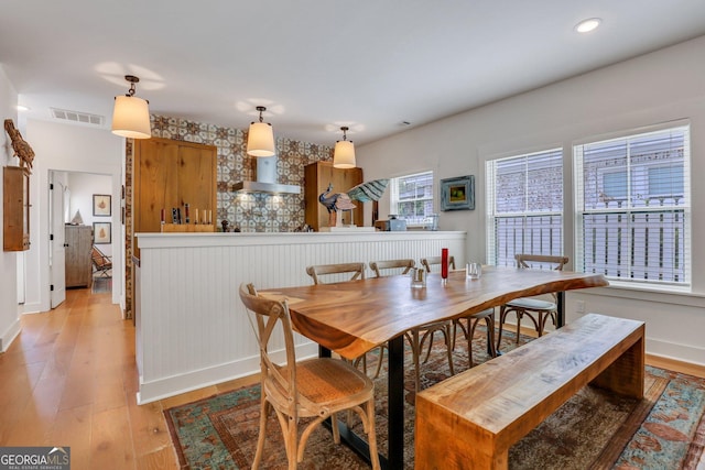 dining space with recessed lighting, visible vents, baseboards, and light wood finished floors