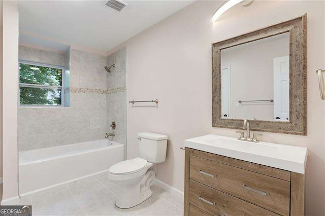 bathroom with vanity, washtub / shower combination, visible vents, tile patterned flooring, and toilet