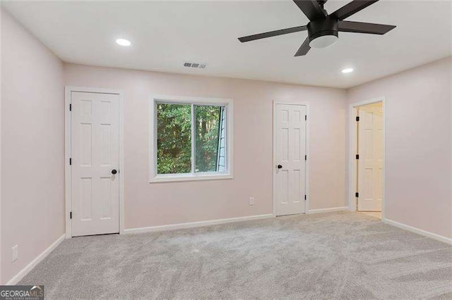 unfurnished bedroom with recessed lighting, visible vents, baseboards, and carpet floors