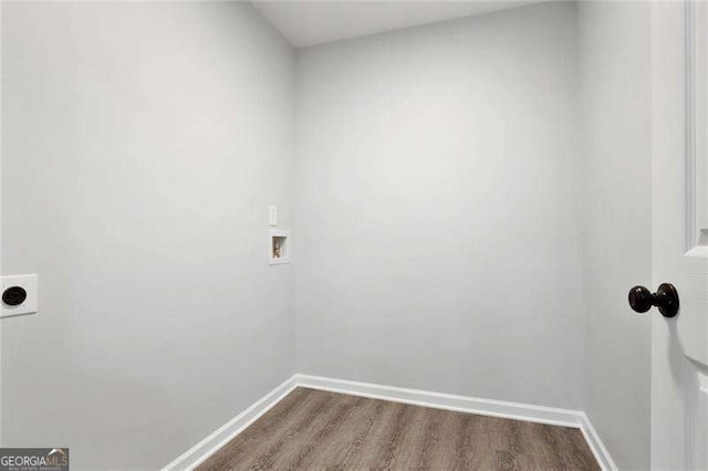 washroom featuring baseboards, laundry area, hookup for a washing machine, electric dryer hookup, and dark wood-style flooring