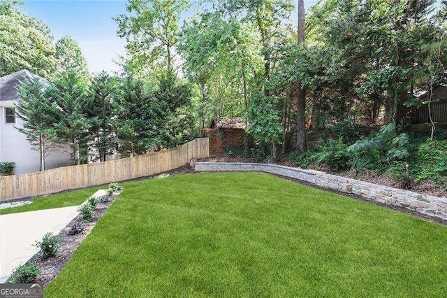 view of yard with a fenced backyard