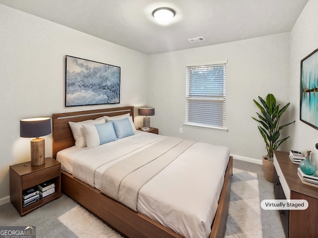 bedroom featuring carpet, visible vents, and baseboards