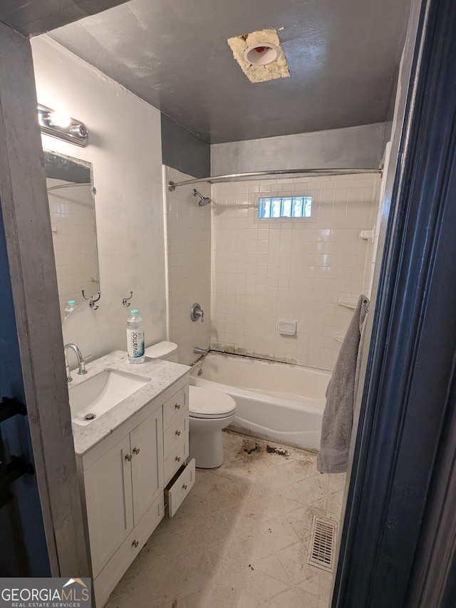 bathroom with visible vents, toilet, shower / washtub combination, and vanity