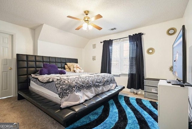 bedroom with ceiling fan, carpet flooring, visible vents, and a textured ceiling