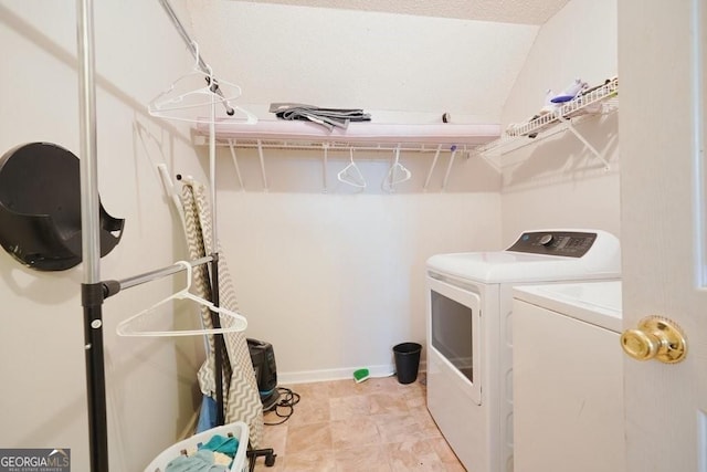 clothes washing area with separate washer and dryer and laundry area