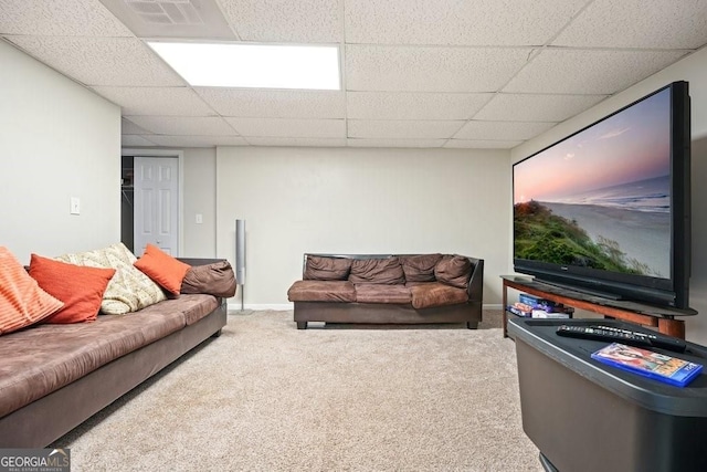 carpeted living room with a paneled ceiling, baseboards, and visible vents