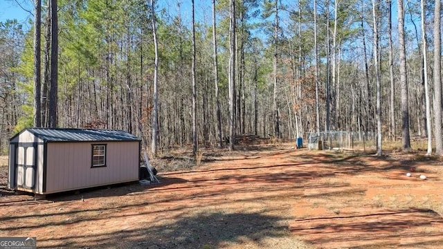 view of street featuring a wooded view