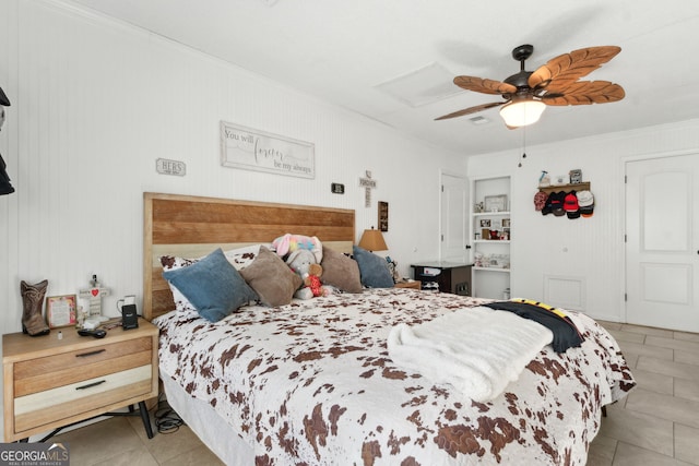 bedroom with tile patterned floors, a ceiling fan, and ornamental molding