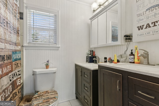 bathroom featuring vanity and toilet