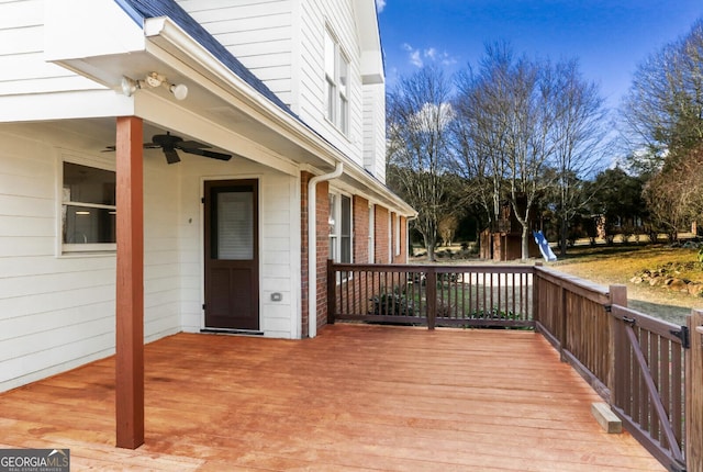 wooden terrace featuring a ceiling fan