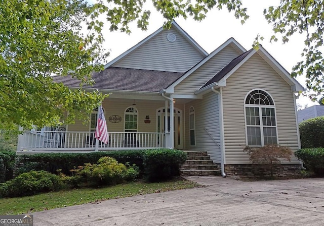 view of front of house featuring a porch and roof with shingles