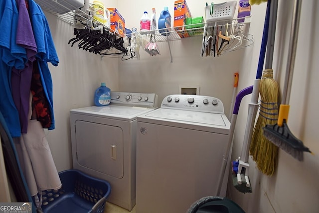 clothes washing area with laundry area and washer and dryer