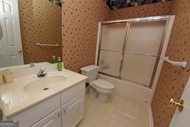 full bathroom featuring vanity, enclosed tub / shower combo, wallpapered walls, tile patterned floors, and toilet