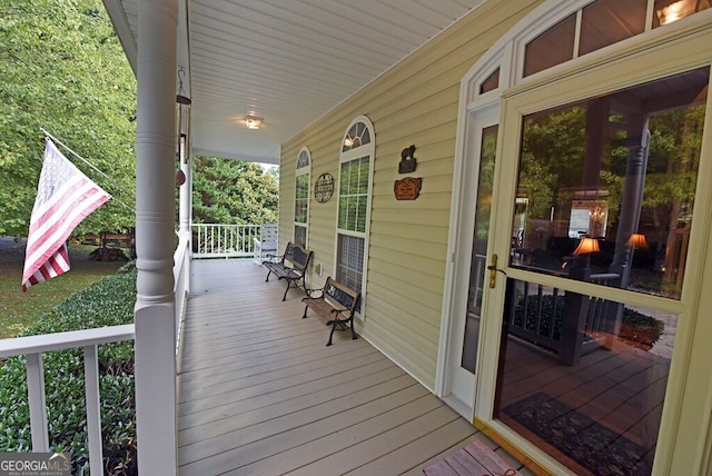 wooden terrace with covered porch