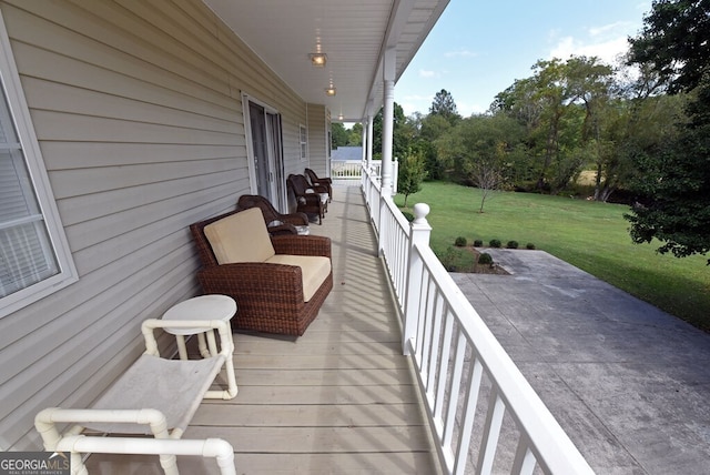 wooden deck with a yard