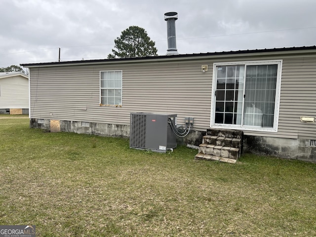 1357 Edgewood Ave, Douglas, GA 31533 - rear view of property with central air condition unit, crawl space, entry steps, and a yard