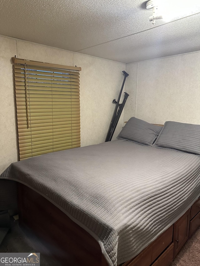 1357 Edgewood Ave, Douglas, GA 31533 - carpeted bedroom featuring a textured ceiling and a textured wall