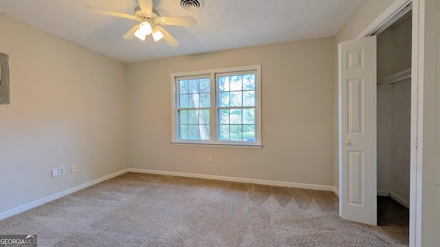 unfurnished bedroom featuring visible vents, carpet floors, baseboards, and ceiling fan