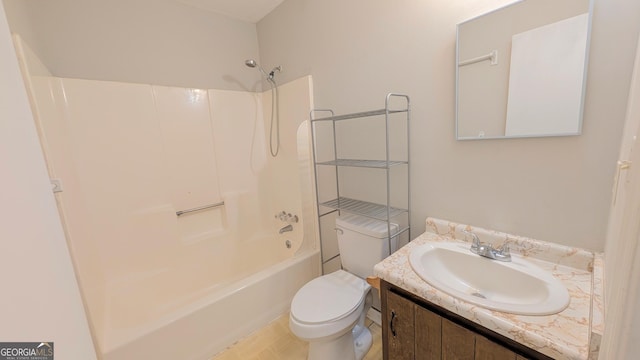 bathroom with toilet, vanity, and washtub / shower combination