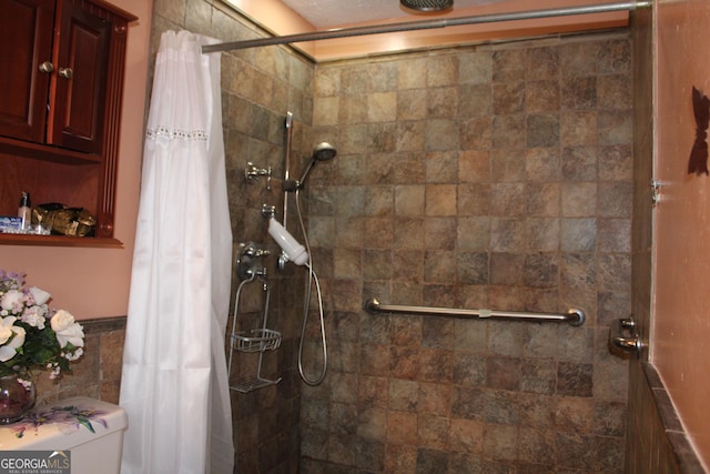 full bath featuring tile walls and tiled shower