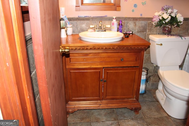 bathroom with toilet and vanity