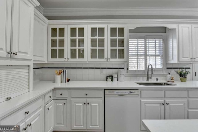 kitchen featuring a sink, white cabinets, and white dishwasher