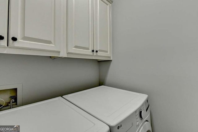 laundry room with cabinet space and separate washer and dryer